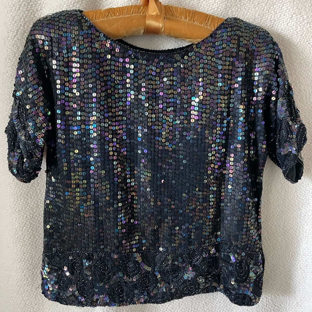Sequins and beaded detail top. Black base w multi color details